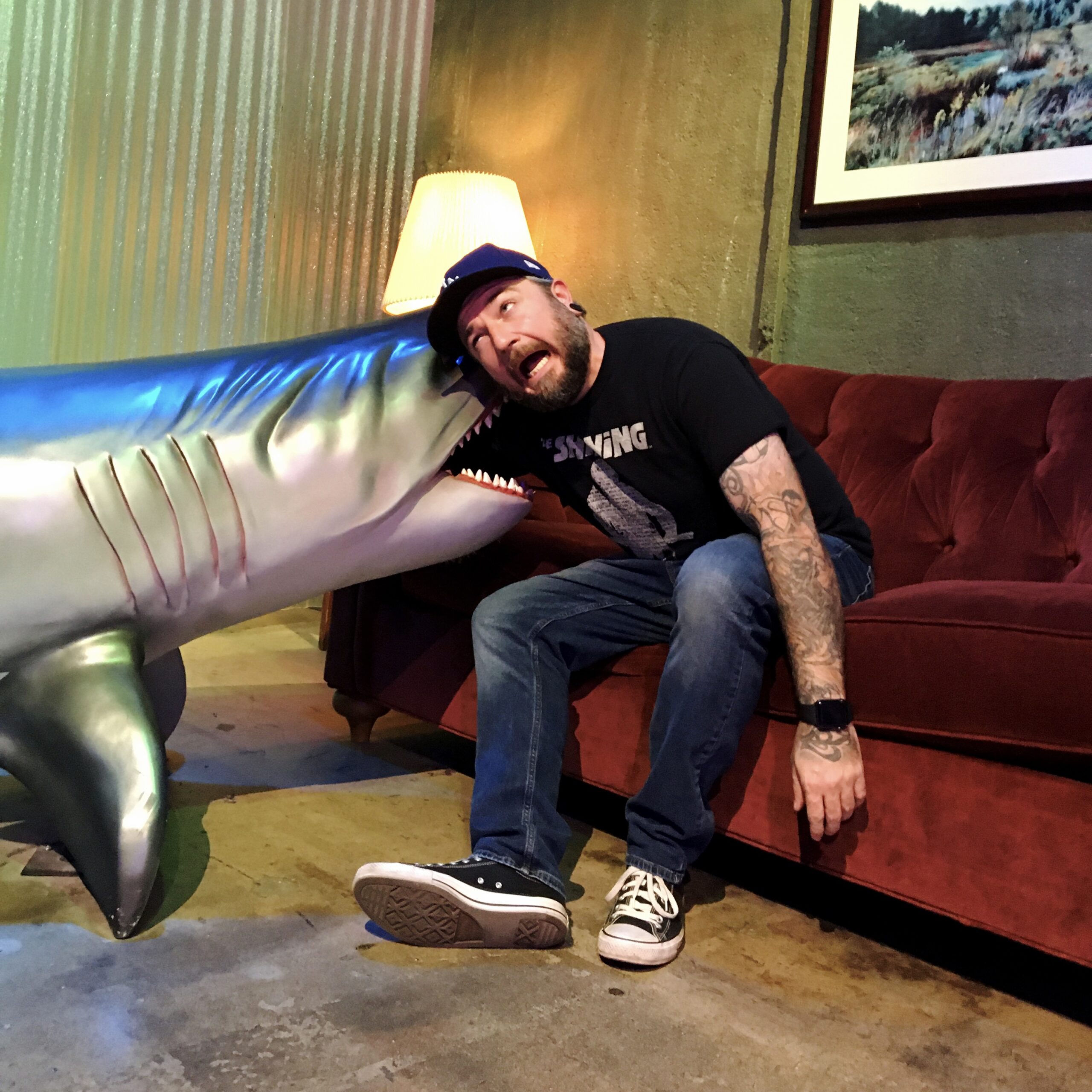 Spider Barks creator, Devin Welborn, getting chomped on by a shark in the Beetlejuice Netherworld Waiting Room of the I Like Scary Movies Experience.